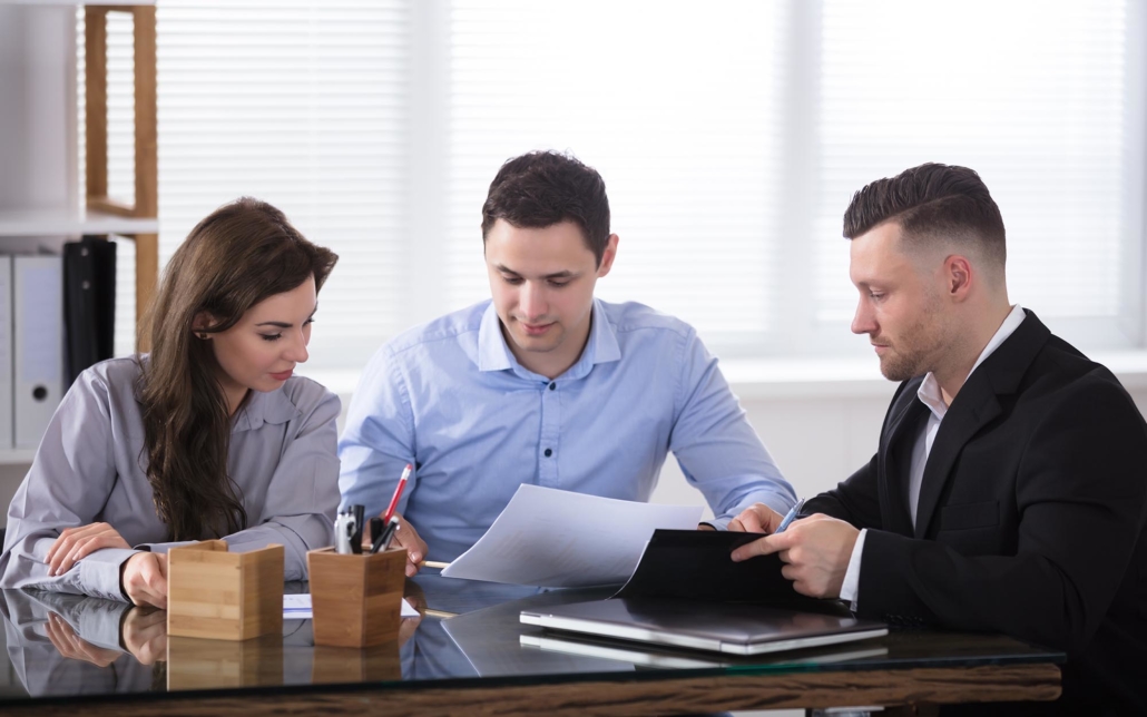 Couple sits with Tax services advisor