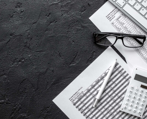 taxes accounting in office work space on dark desk background top view mockup