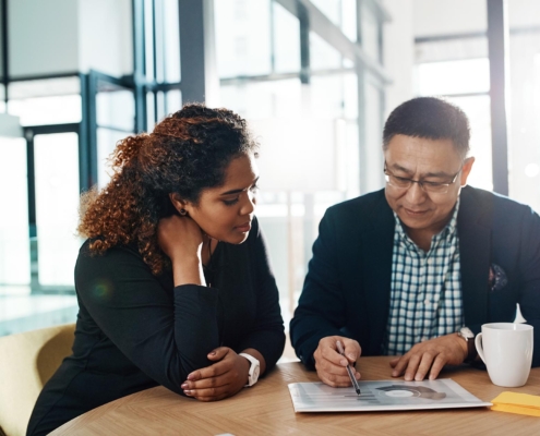 two people looking at retirement planning