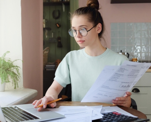 Young person calculating loans