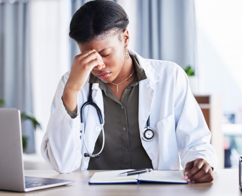 Nurse in office stressed