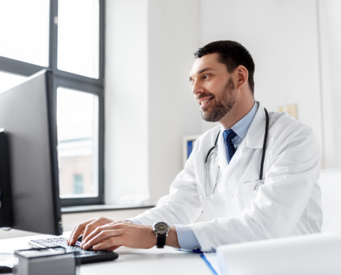 healthcare, medicine and people concept - happy smiling male doctor