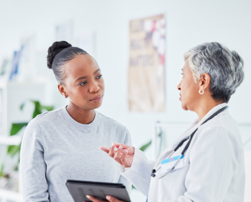 Doctor, woman and tablet for hospital, healthcare advice and support for results